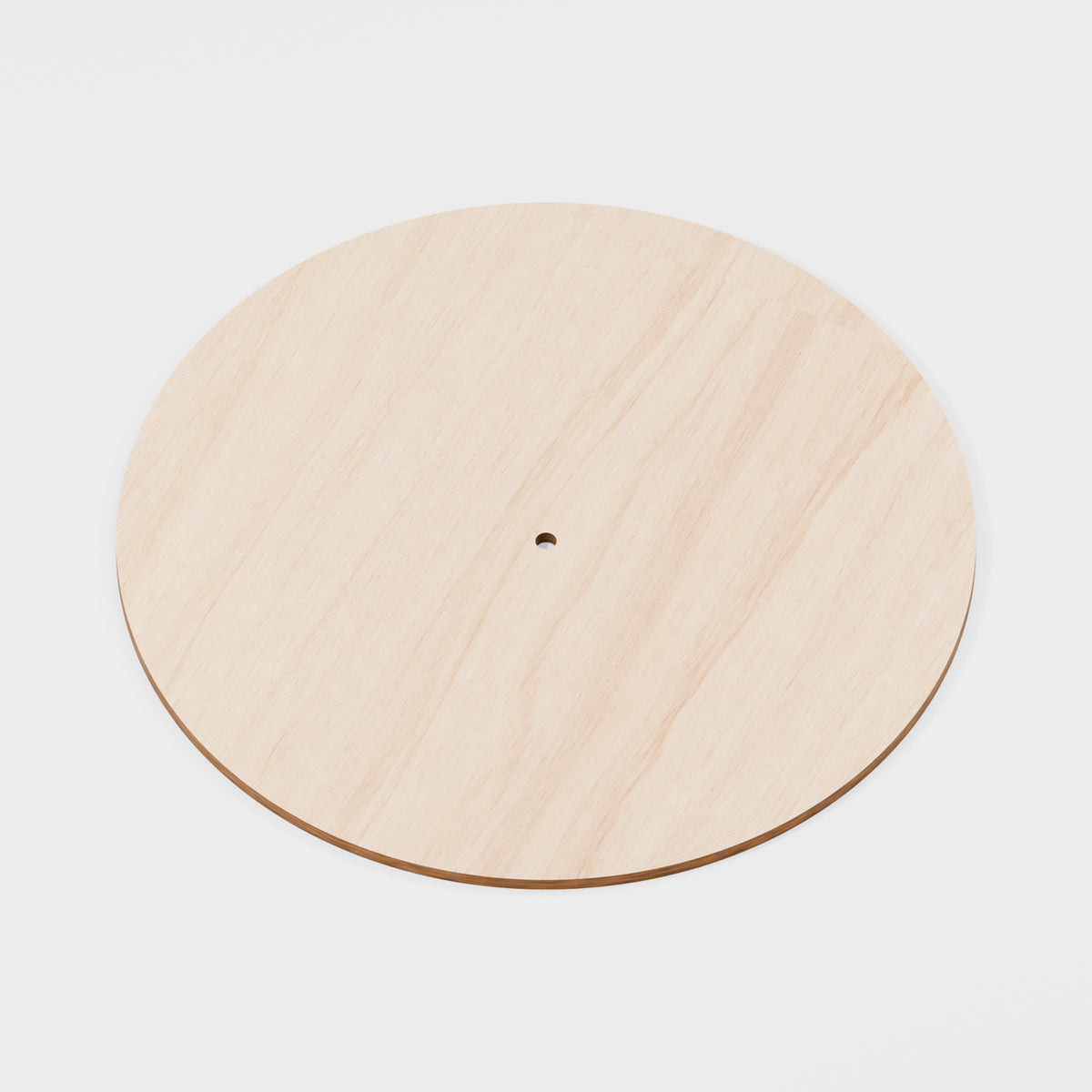 Bare wooden clock blank with centre shaft hole; no hands fitted — product visualisation