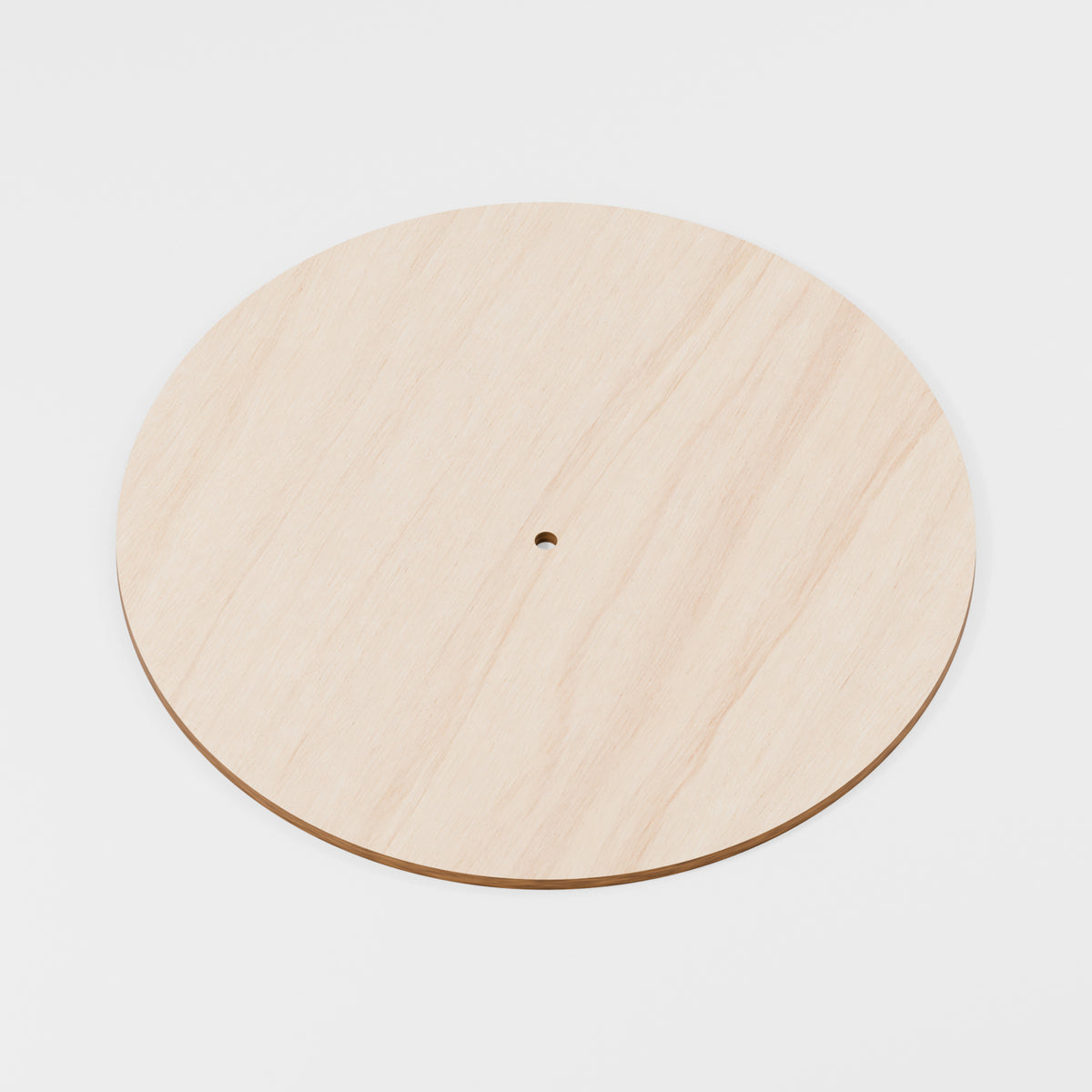 Bare wooden clock blank with centre shaft hole; no hands fitted — product visualisation